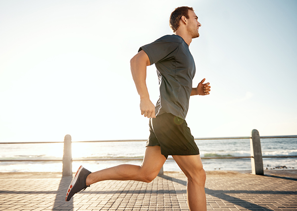 Young man running by the ocean. - Leaks while Running in Webster, TX